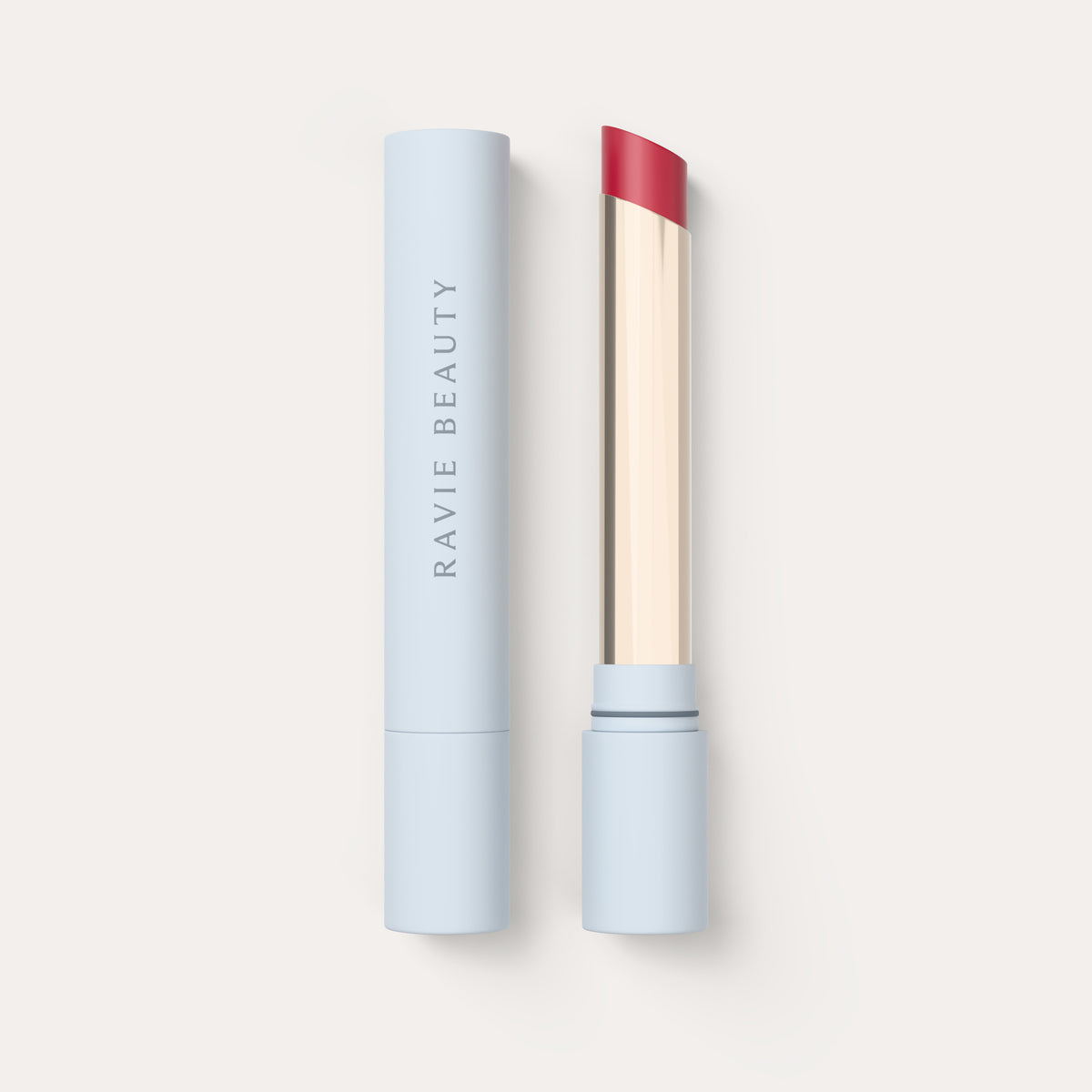 An open tube beside its cap. Ravie Beauty Effortless Lips™ Sheer-Buildable Lip Color in Rose 