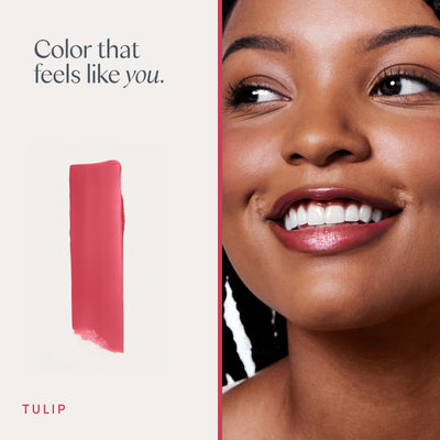 Color that feels like you. A model wearing it, and a swipe of the color. Ravie Beauty Effortless Lips™ Sheer-Buildable Lip Color in Tulip 