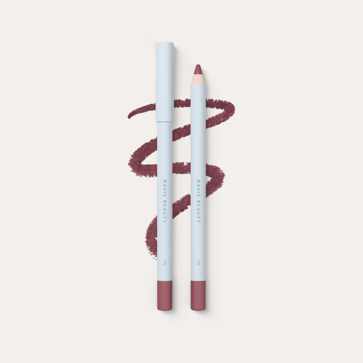 Two pencils and a swatch. Ravie Beauty Soft Definition™ Longwear Lip Liner in Fig 