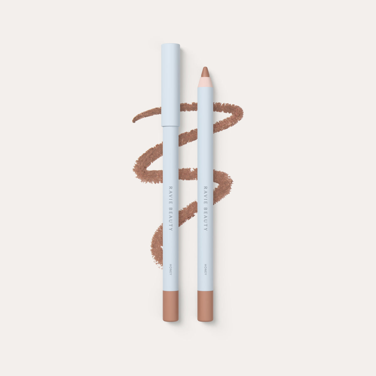 Two pencils and a swatch. Ravie Beauty Soft Definition™ Longwear Lip Liner in Honey 