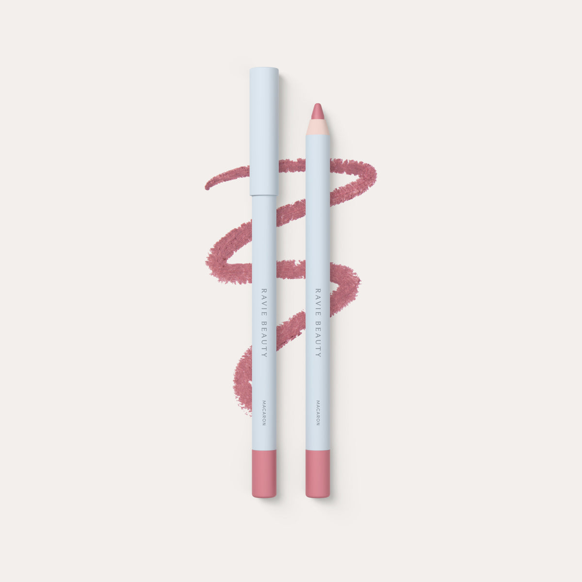 Two pencils and a swatch. Ravie Beauty Soft Definition™ Longwear Lip Liner in Macaron #color_macaron