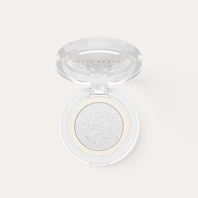 An open compact. Ravie Beauty Softlight™ Glistening Eye Topper in Soft Pearl 
