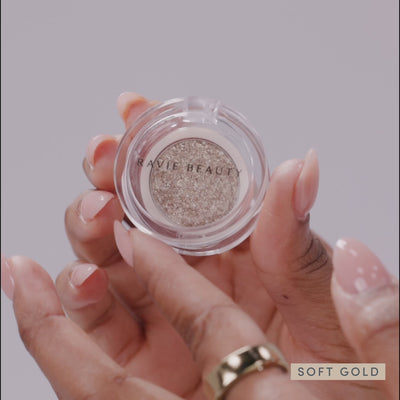 Models wearing it, and the sparkle catching the light. Ravie Beauty Softlight™ Glistening Eye Topper in Soft Gold 
