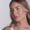 Three models wearing it. Ravie Beauty Effortless Lips™ Sheer-Buildable Lip Color in Peony #color_peony